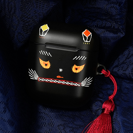 An AirPods case is decorated with the face of a tiger illustrated in minhwa, a Korean folk painting style. (National Museum of Korea)