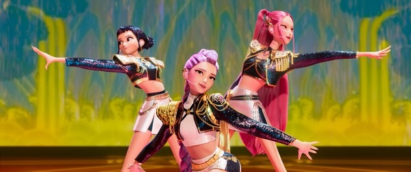 Fictional K-pop superstars Rumi, Mira and Zoey perform on a stage designed to resemble "Irworobongdo," a traditional Korean folding screen depicting the sun, moon and five mountain peaks, in "KPop Demon Hunters." (Netflix)