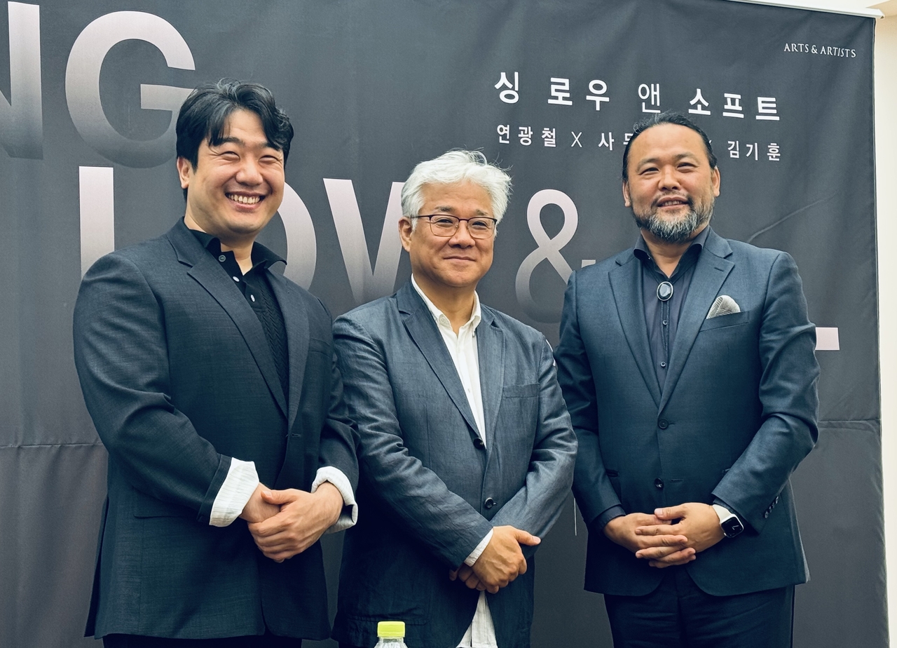 From left: Baritone Kim Gi-hoon, bass Youn Kwang-chul and bass-baritone Samuel Youn pose for photos during a press conference at Museum Hanmi in Samcheong-dong, Seoul, Tuesday. (Park Ga-young//The Korea Herald)