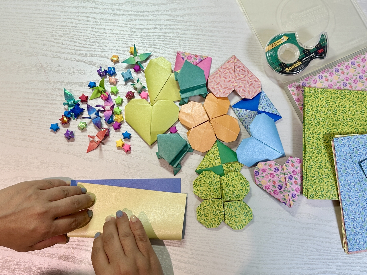 Kwon folds origami, one of her favorite pastimes. From small cranes to big frogs, Kwon has been learning techniques to advance her origami skills and kill time. (Lee Jung-joo/The Korea Herald)