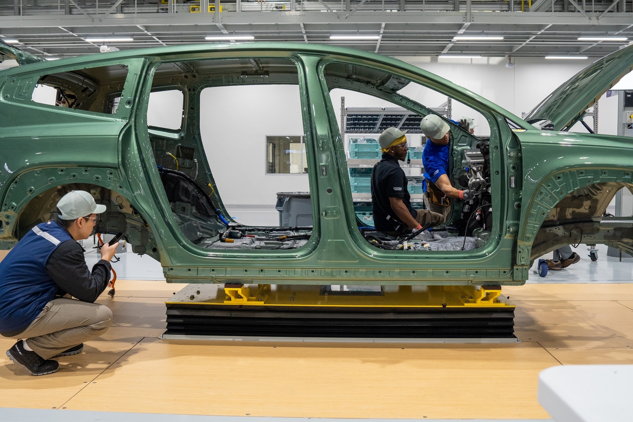 Workers assemble an Ioniq 9 electric SUV at Hyundai Motor Group's plant in the US state of Georgia. (Hyundai Motor Group)