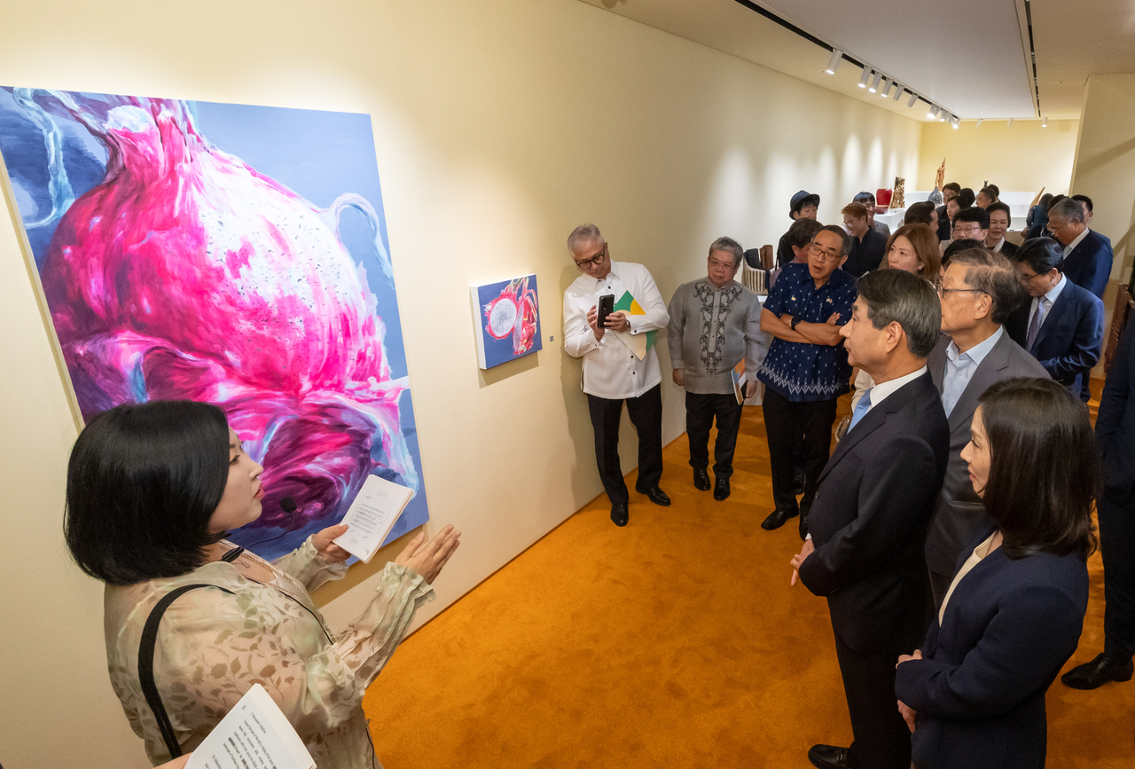 Visitors view displays at the inaugural exhibition, “Fruity Fruit: Colorful Days in Southeast Asia,” held at the Korea Press Center on Friday. (ASEAN-Korea Centre)
