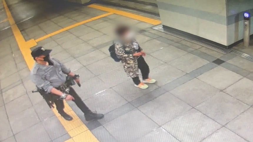This photo distributed by police shows a man in his 50s walking around a subway station in Goyang, Gyeonggi Province, on June 27, wearing fake police gear. (Gyeonggi Bukbu Provincial Police Agency)