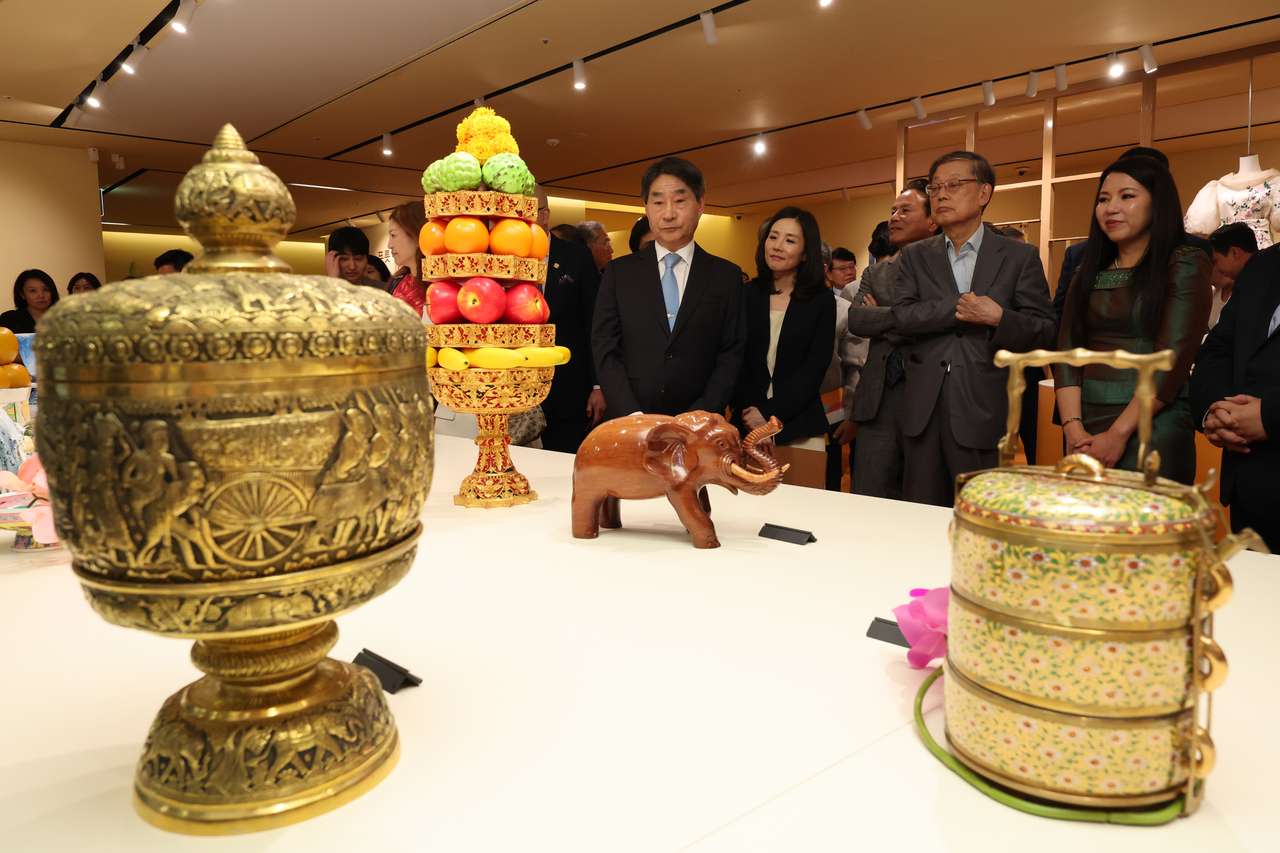 Visitors view displays at the inaugural exhibition, “Fruity Fruit: Colorful Days in Southeast Asia,” held at the Korea Press Center on Friday. (Yonhap)