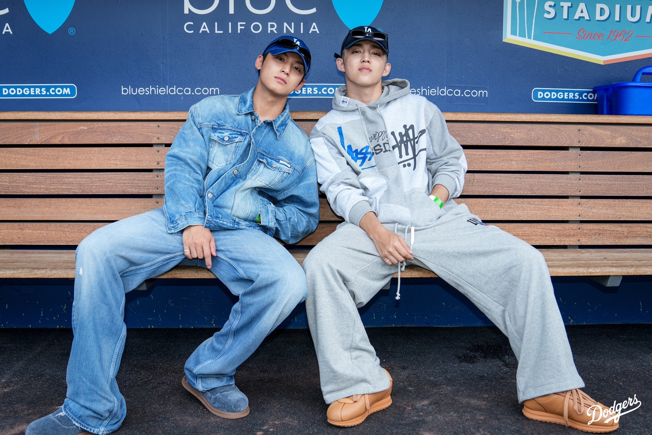 S.Coups and Mingyu of SEVENTEEN photographed at a Los Angeles Dodgers game while shooting the music video for their duo subunit release
