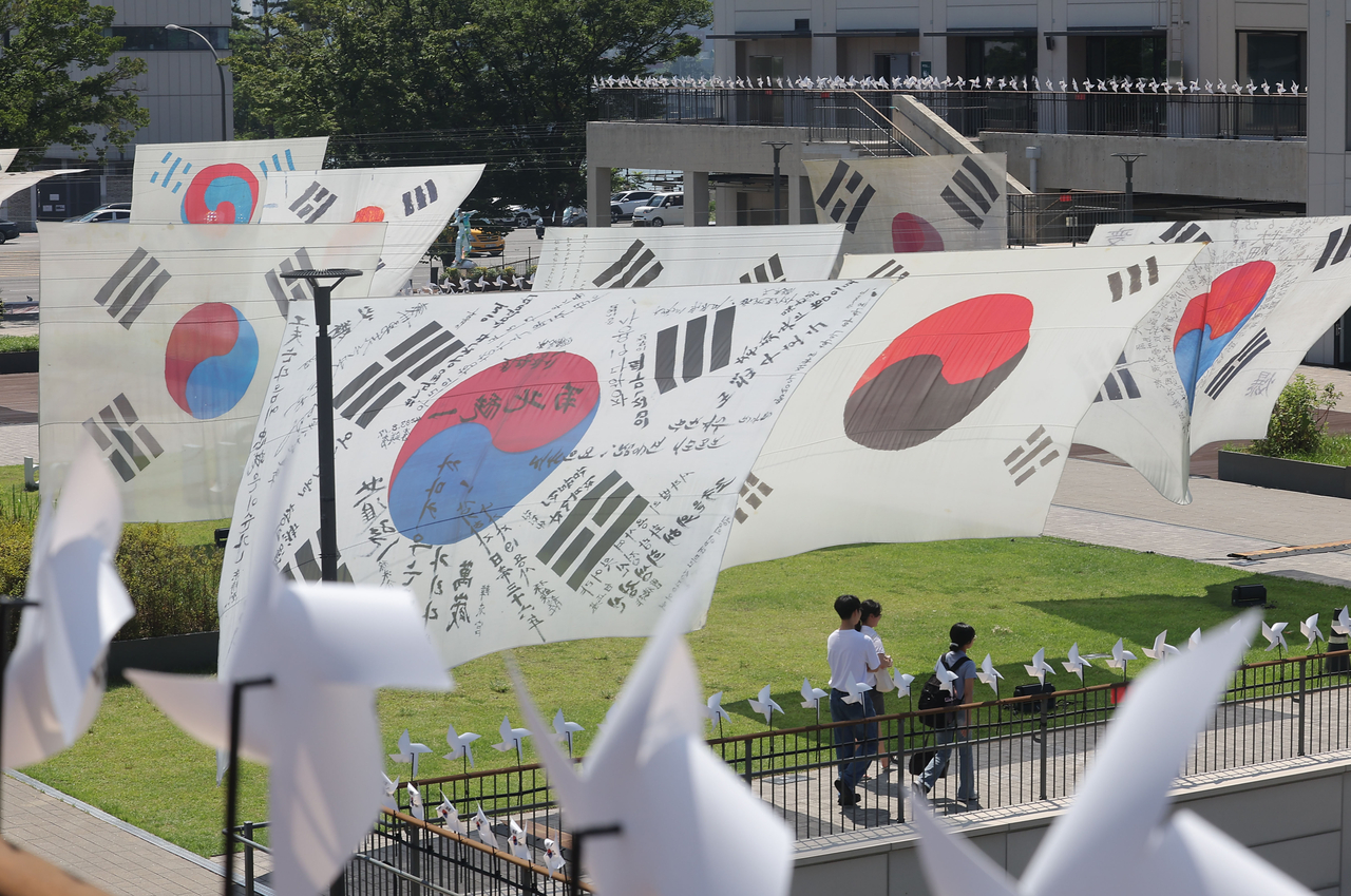 Large period reproductions of the South Korean Taegeukgi national flag flutter on Nodeul Island in Seoul ahead of the 80th anniversary of Liberation Day Gwangbokjeol