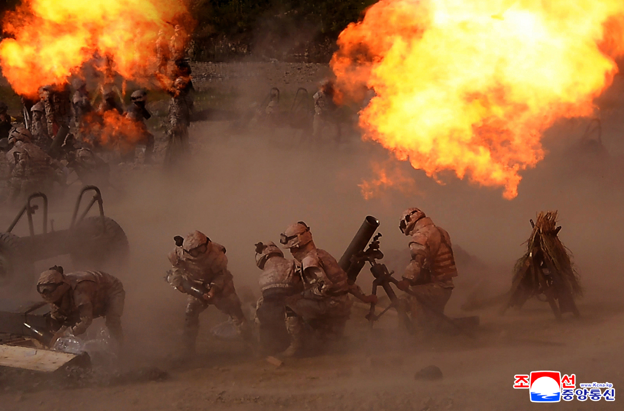 This photo shows the North's artillery subunits of the Korean People's Army conducting firing drills held on Monday. (Yonhap)