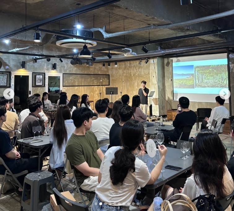 A seminar hosted by Wine & Dining, where members learn about different wine varieties. (Wine & Dining)