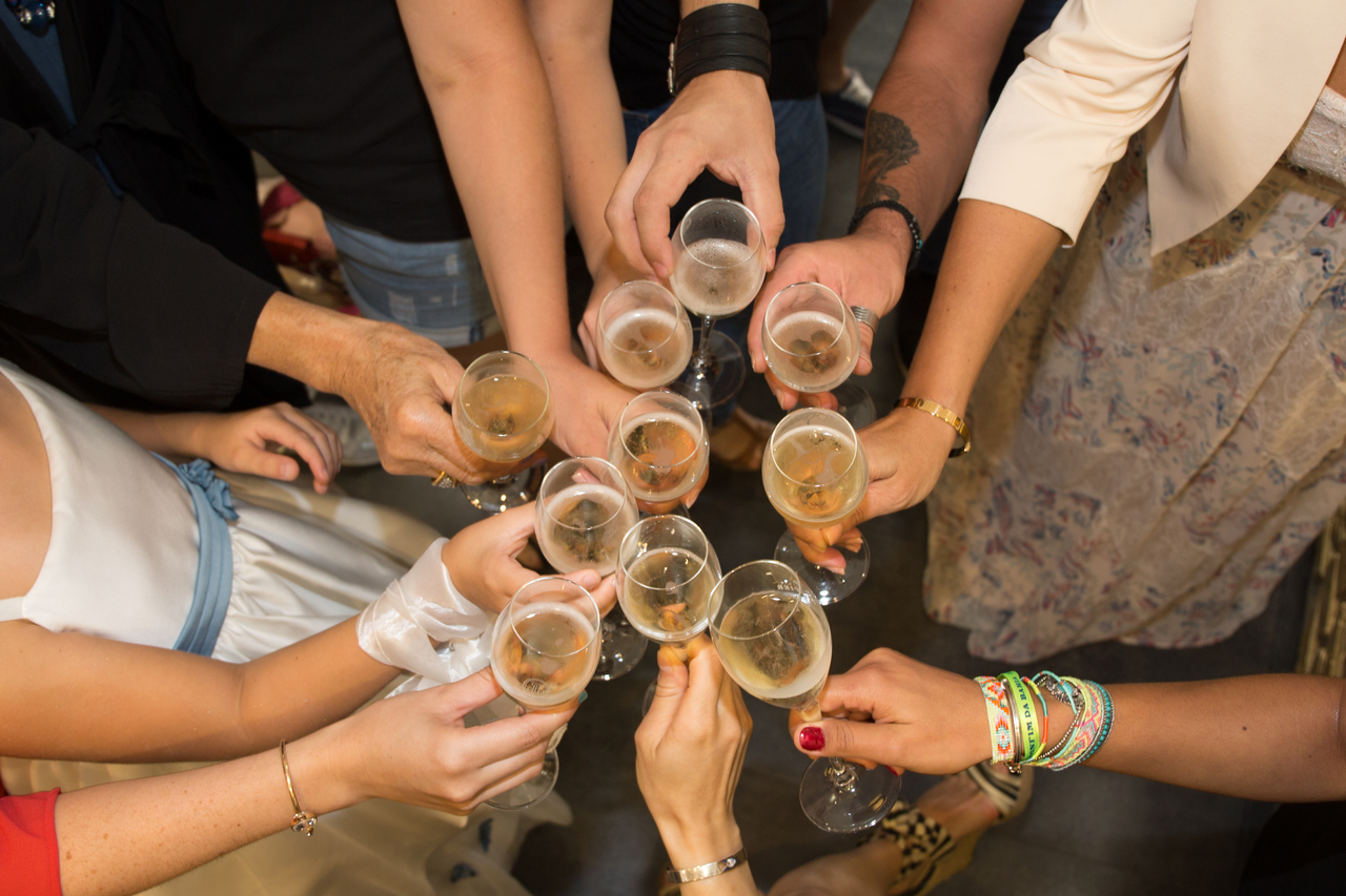 Students toast with champagne glasses