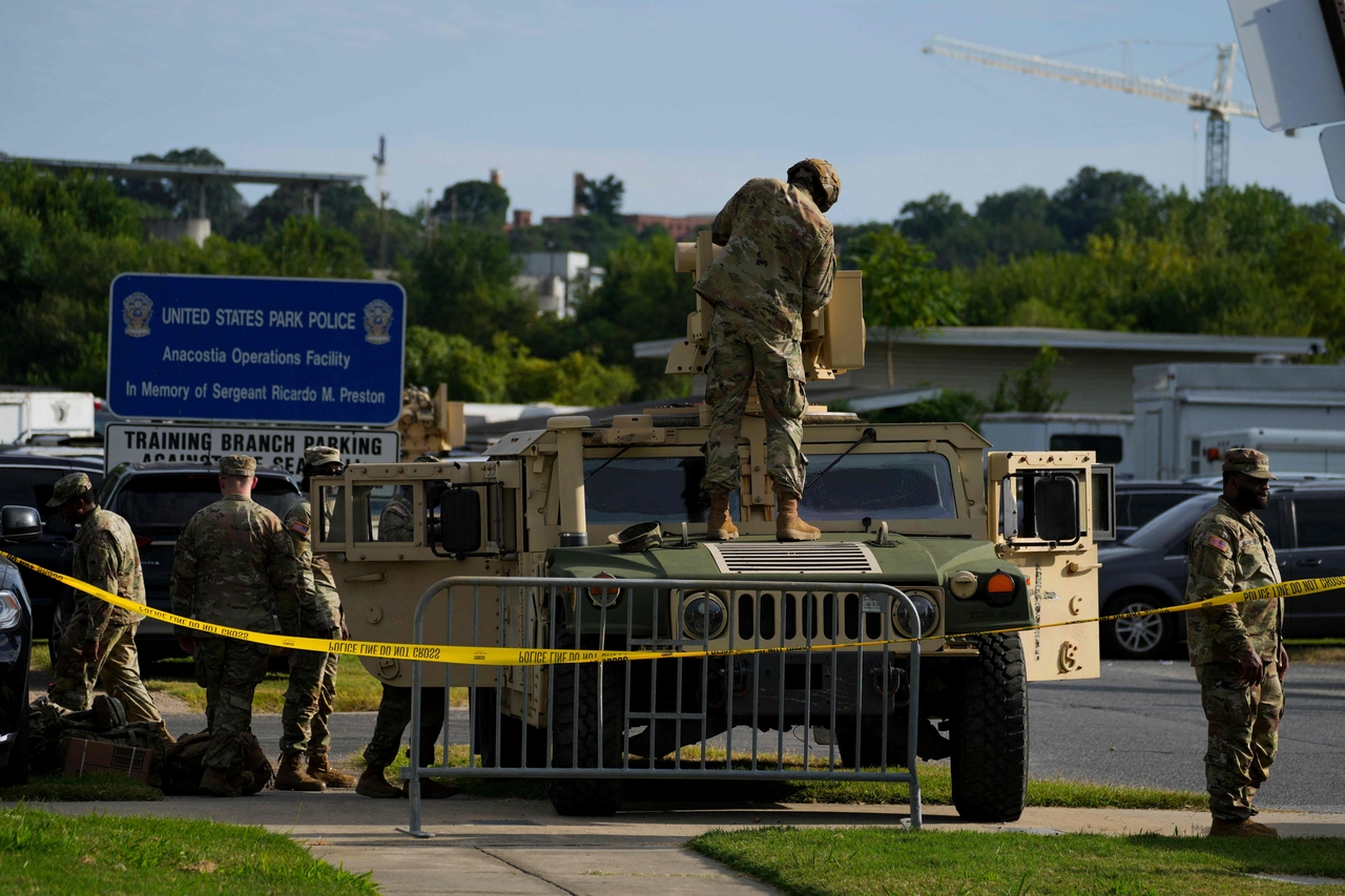 Members of the military stand guard alongside a military Humvee at the US Park Police Anacostia Operations Facility in Washington on Tuesday.   AFP-Yonhap