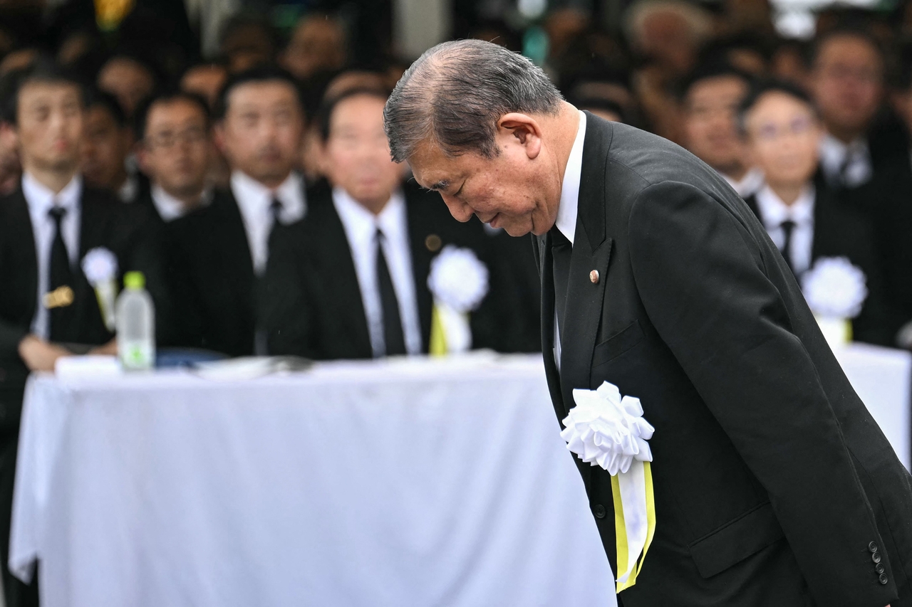 Japan's Prime Minister Shigeru Ishiba bows as he approaches the podium to give a speech during the annual memorial ceremony for the victims at the Peace Park in Nagasaki on Aug. 9  to mark the 80th anniversary of the atomic bombing during WWII.  (AFP)