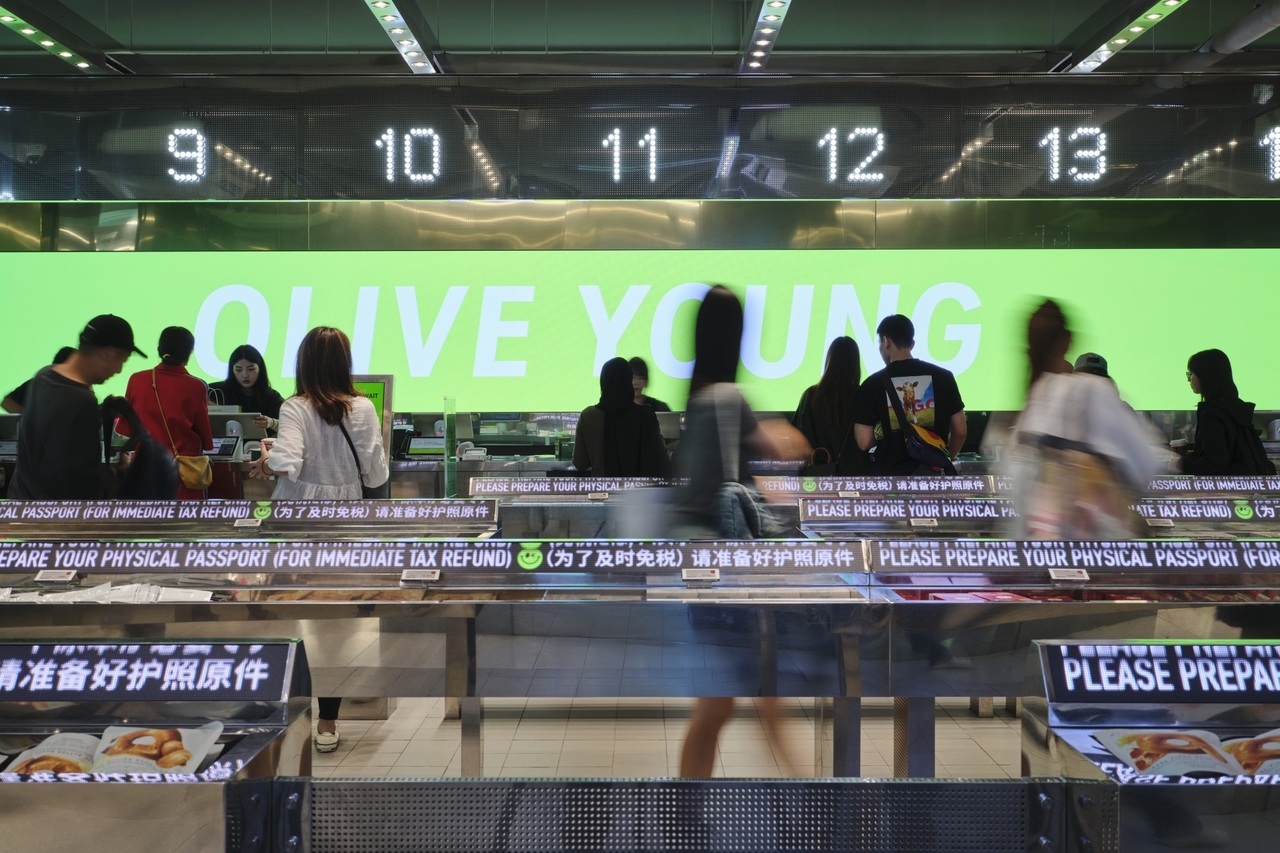 Customers line up at the checkout area of Olive Young’s flagship store in Myeong-dong, central Seoul, in July. (CJ Olive Young)