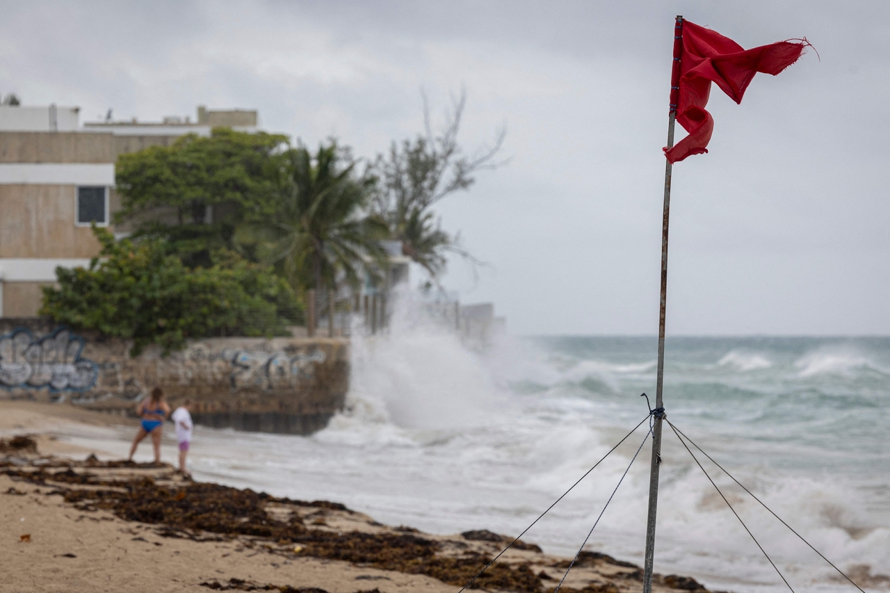 A ripped red flag warning of rip current waves as Category 5 Hurricane Erin approaches in San Juan, Puerto Rico, Saturday. (AFP-Yonhap)
