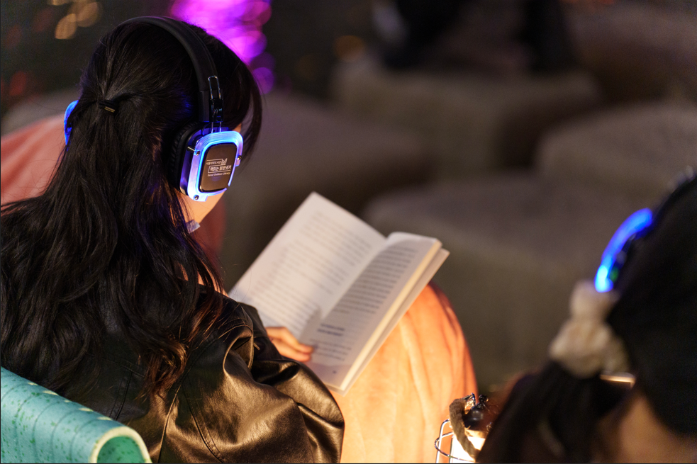A visitor enjoys her time at this year's Seoul Outdoor Library at Seoul Plaza in Jung-gu, central Seoul. (Seoul Metropolitan Government)