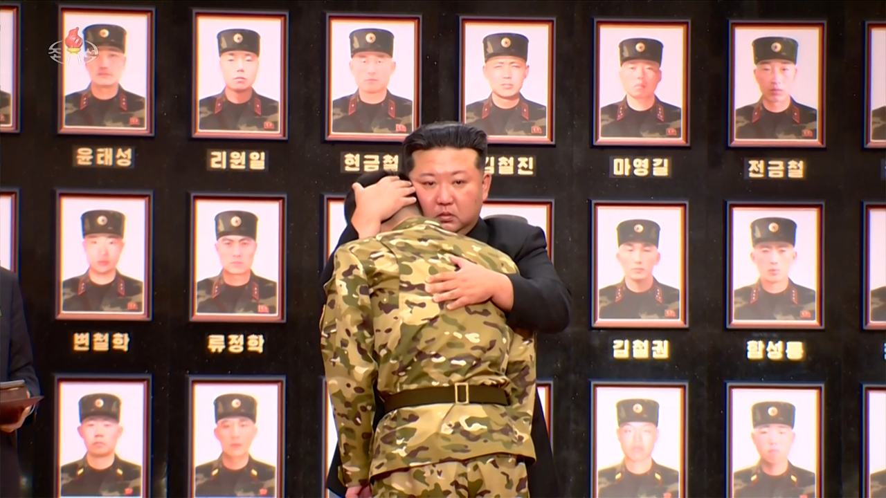 North Korean leader Kim Jong-un presents state commendations to overseas operations veterans during a ceremony at the Workers’ Party Central Committee headquarters, as reported by the Korean Central News Agency on Friday. (Yonhap)