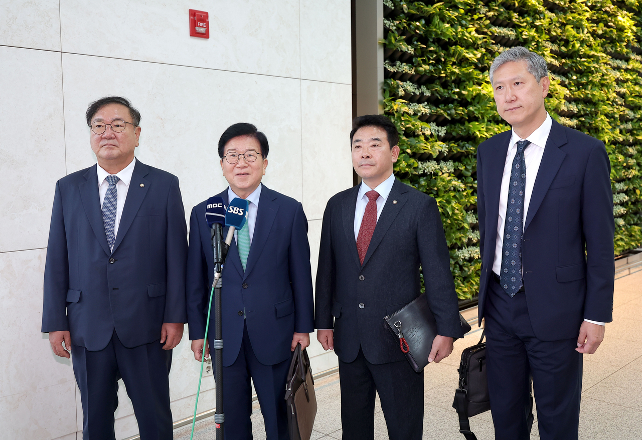 (From left) President Lee Jae Myung's special envoys to China, ruling Democratic Party lawmakers Kim Tae-nyeon, former National Assembly Speaker Park Byeong-seug,  Park Jeung and Roh Jae-hun, son of former President Roh Tae-woo, speak to reporters at Incheon International Airport, west of Seoul, on Aug. 24, 2025, before their departure for Beijing. (Yonhap)