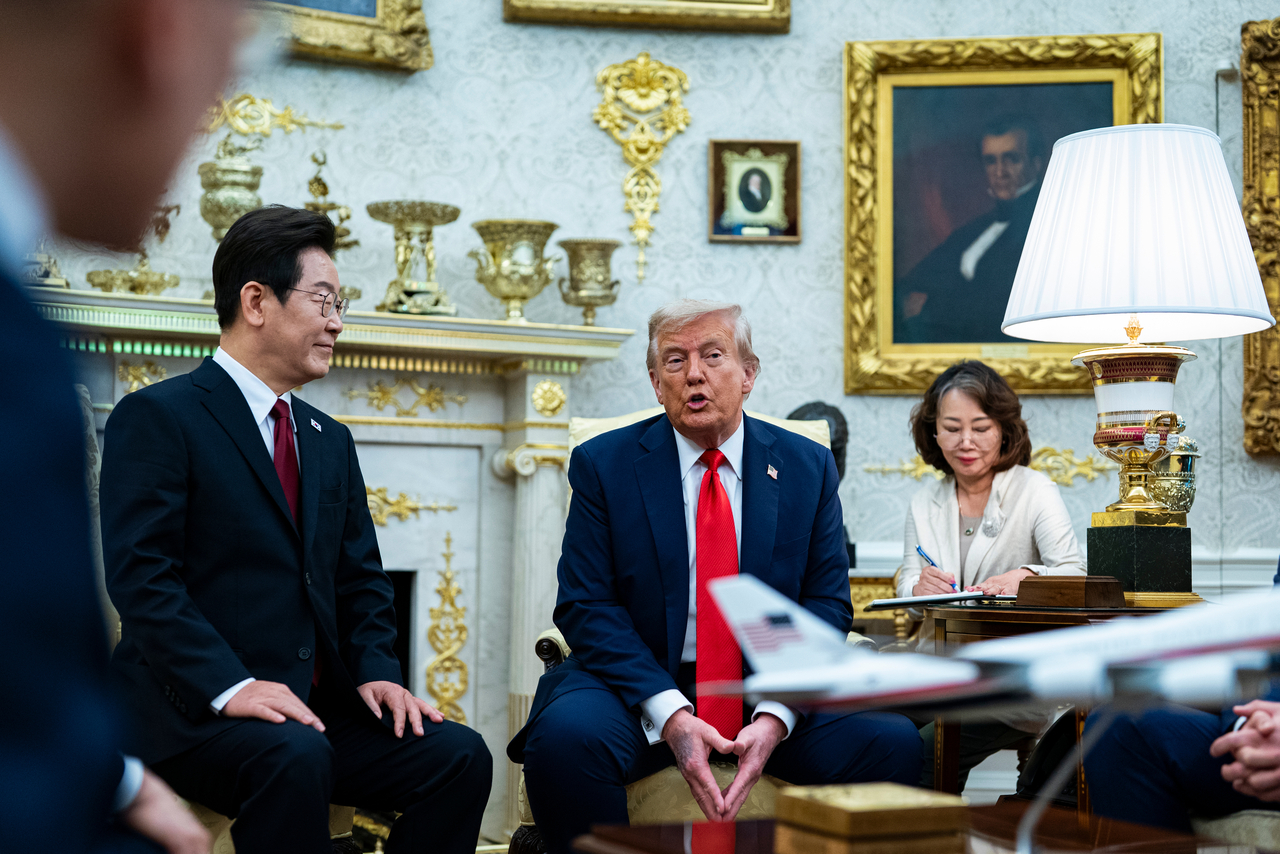 US President Donald Trump (second from left) speaks during a meeting with South Korean President Lee Jae Myung in the Oval Office of the White House in Washington on Monday. (UPI)
