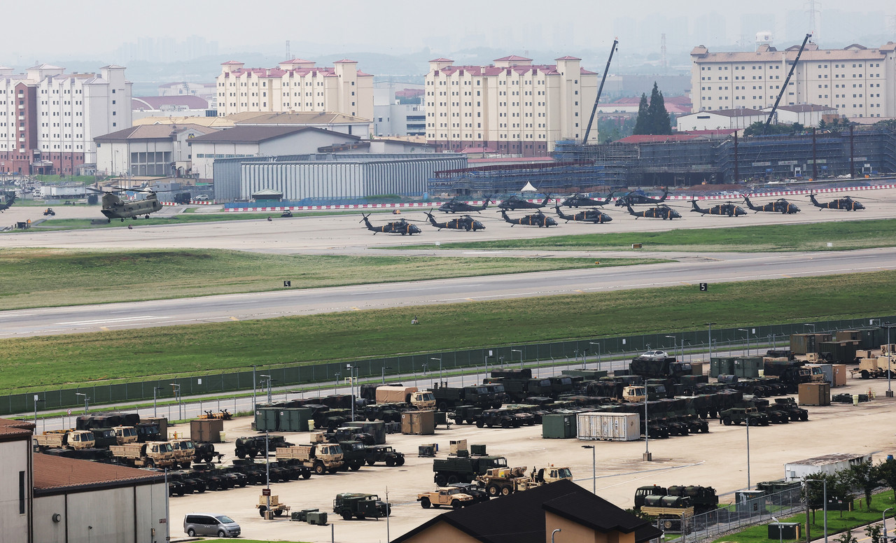 Vehicles and helicopters are parked at Camp Humphreys in Pyeongtaek, Gyeonggi Province, Tuesday. (Yonhap)