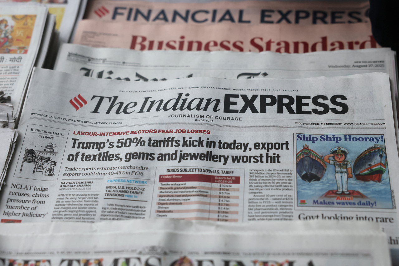 The latest edition of the Indian Express, with the lead story on US tariffs on most Indian goods, is displayed for sale in New Delhi on Wednesday.   Reuters-Yonhap
