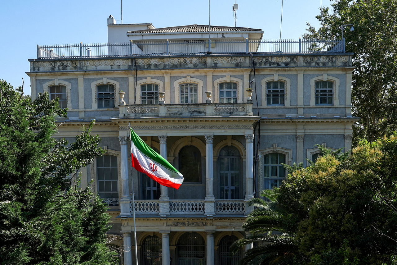 An Iranian flag flutters in front of the Iranian Consulate in Istanbul, Turkey, in July. (AFP-Yonhap)