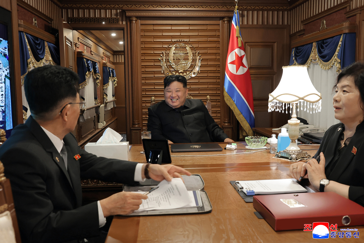 North Korea’s official Korean Central News Agency on Tuesday released a photo showing leader Kim Jong-un (center) departing for Beijing by private train the previous day to attend a Chinese event marking the 80th anniversary of Japan’s surrender and the end of World War II. (Yonhap)