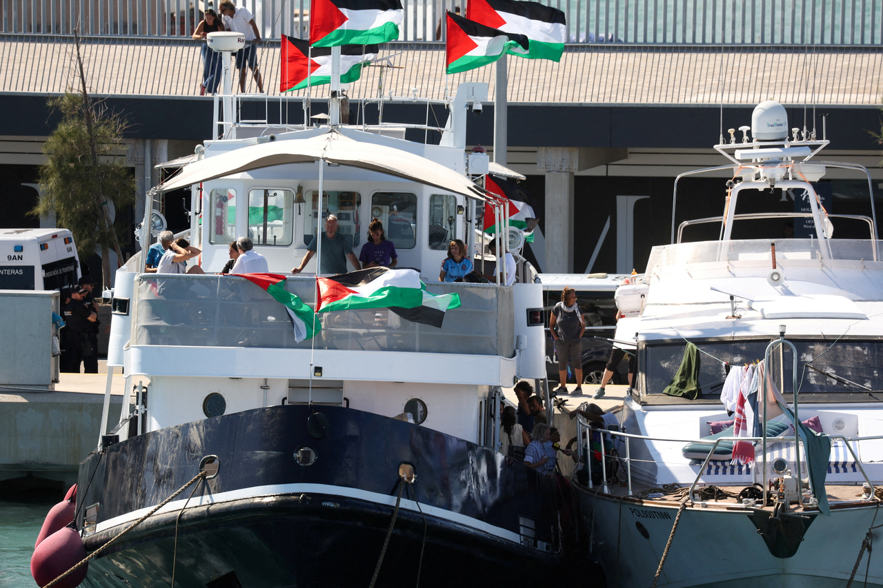 Swedish activist Greta Thunberg and other Global Sumud Flotilla members wait on their boat to depart to Gaza from Barcelona, Spain, Monday. (Reuters-Yonhap)