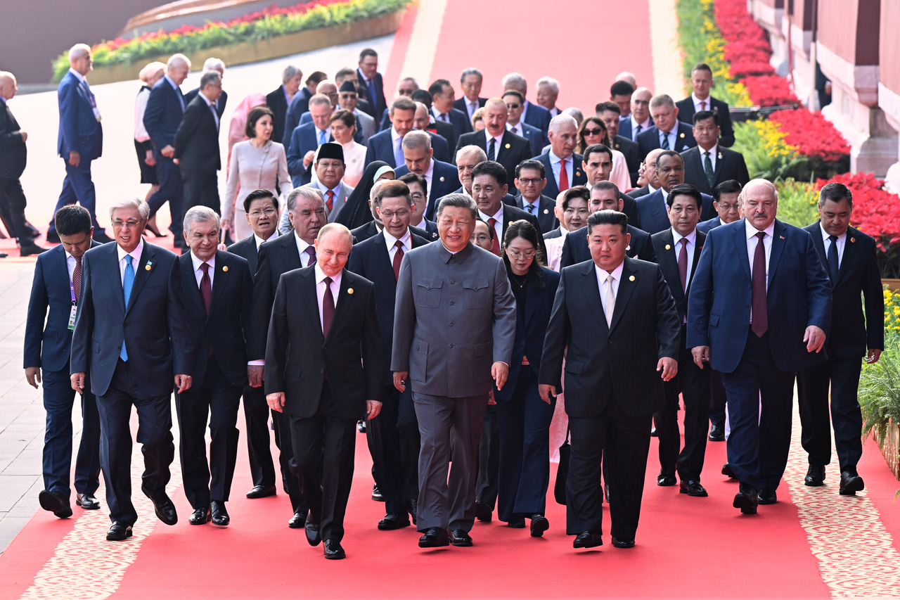 Chinese President Xi Jinping (center) and foreign leaders including Russia President Vladimir Putin (center left) and North Korean leader Kim Jong-un (center right) walk to Tiananmen Rostrum ahead of a ceremony to commemorate the 80th anniversary of the end of World War II following Japan's surrender on Wednesday. (Xinhua News Agency via AP)