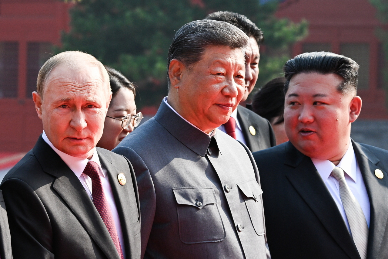 From left: Russian President Vladimir Putin, Chinese President Xi Jinping and North Korea's leader Kim Jong-un are seen ahead of a military parade in Beijing on Wednesday marking the 80th anniversary of the end of World War II.  (Pool photo via Tass)