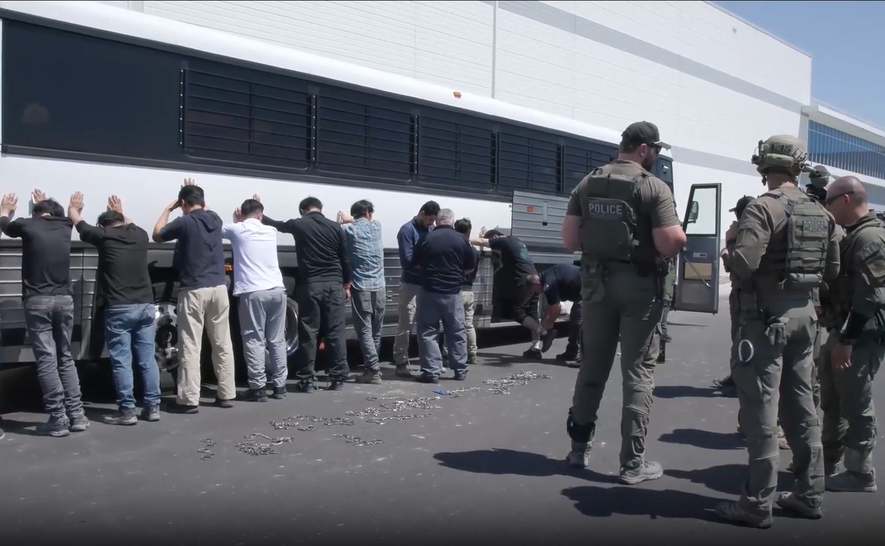 This still image taken from video footage shows workers arrested during an immigration crackdown at the construction site for a plant to be operated by a Hyundai-LG joint venture in Georgia on Thursday. (ICE/Yonhap)