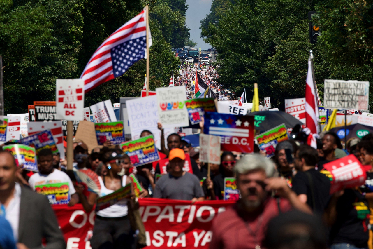 People participate in a march against the deployment of National Guard troops in Washington, Saturday. (AFP-Yonhap)