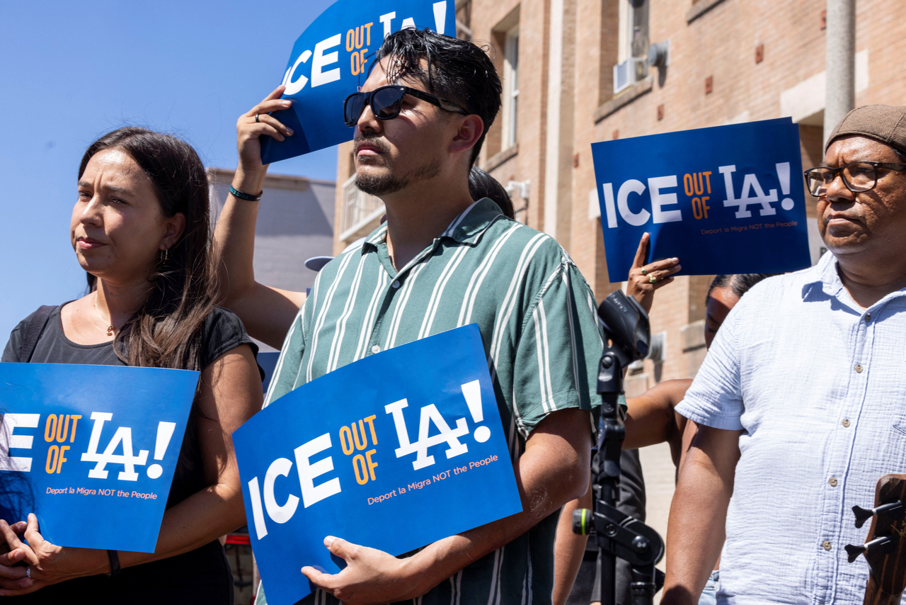 Activists hold signs at a press conference in Los Angeles on Monday. (Reuters-Yonhap)