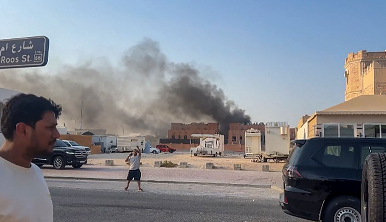 This frame grab taken from an AFPTV footage shows smoke billowing after explosions in Doha's capital Qatar on Tuesday.   AFP-Yonhap