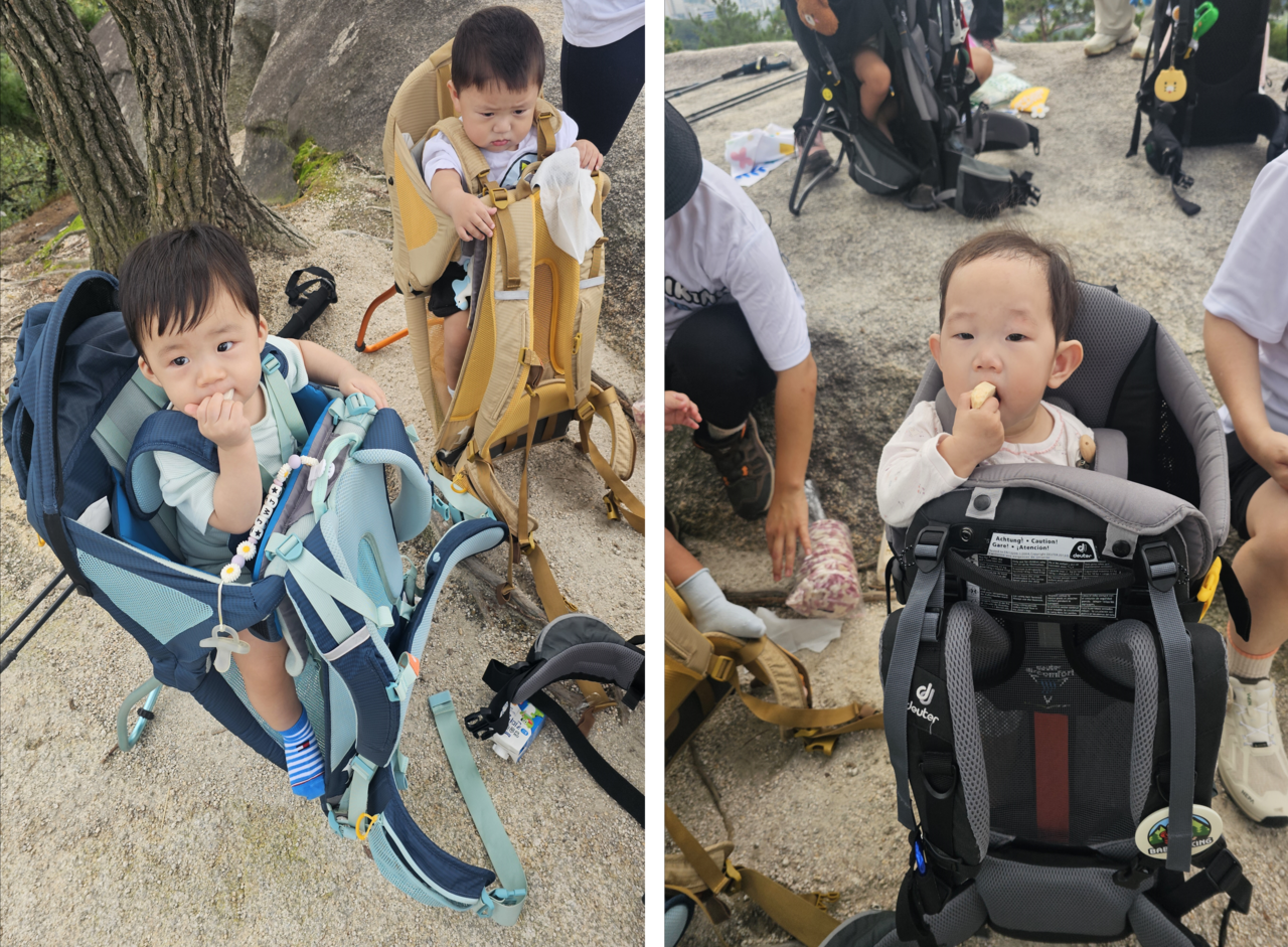 Babies take a break during their arduous hike, enjoying snacks like rice crackers and milk. (Choi Jae-hee/The Korea Herald)