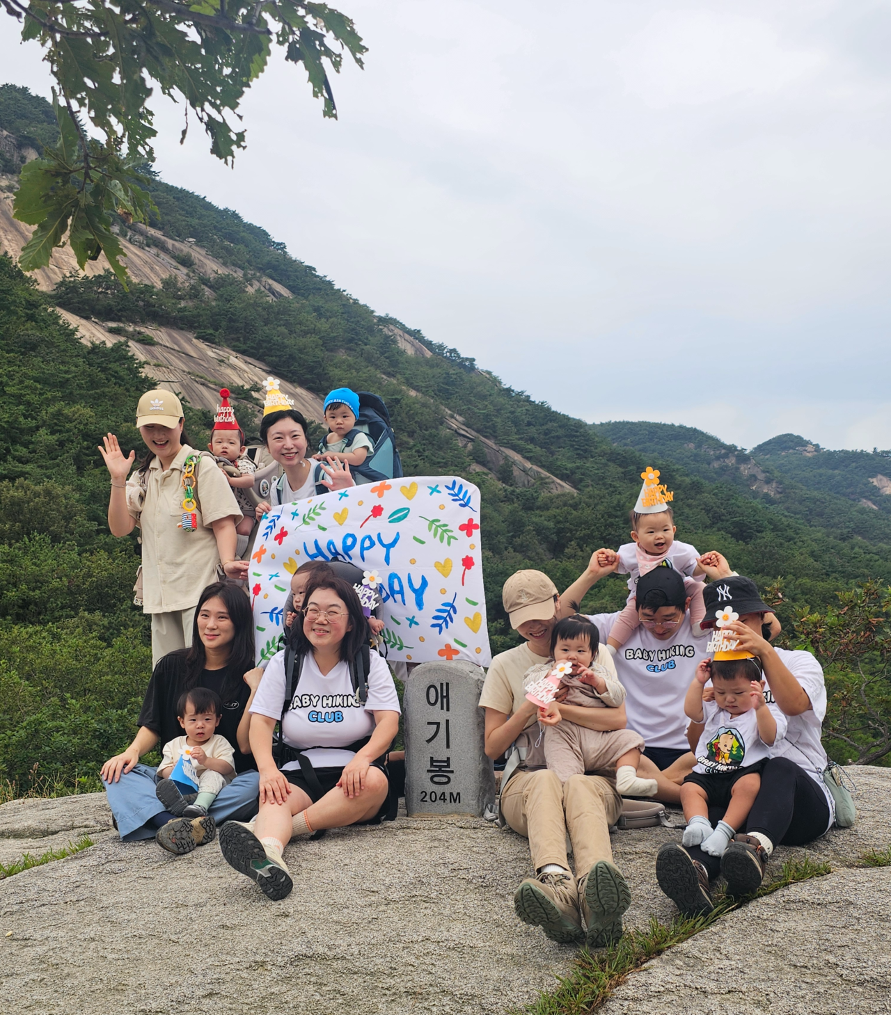Members of the Baby Hiking Club pose for a photo at the Aegibong peak of Buramsan, in Namyangju, Gyeonggi Province, on Tuesday morning. (Choi Jae-hee/The Korea Herald)