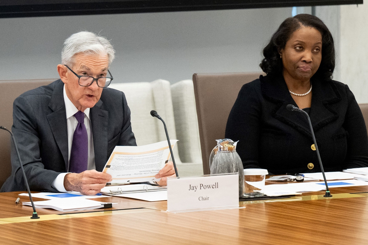 US Federal Reserve Chairman Jerome Powell (left) speaks alongside Board Governor Lisa Cook, as he chairs a Federal Reserve Board open meeting discussing proposed revisions to the board's supplementary leverage ratio standards at the Federal Reserve Board building in Washington on June 25.   AFP-Yonhap