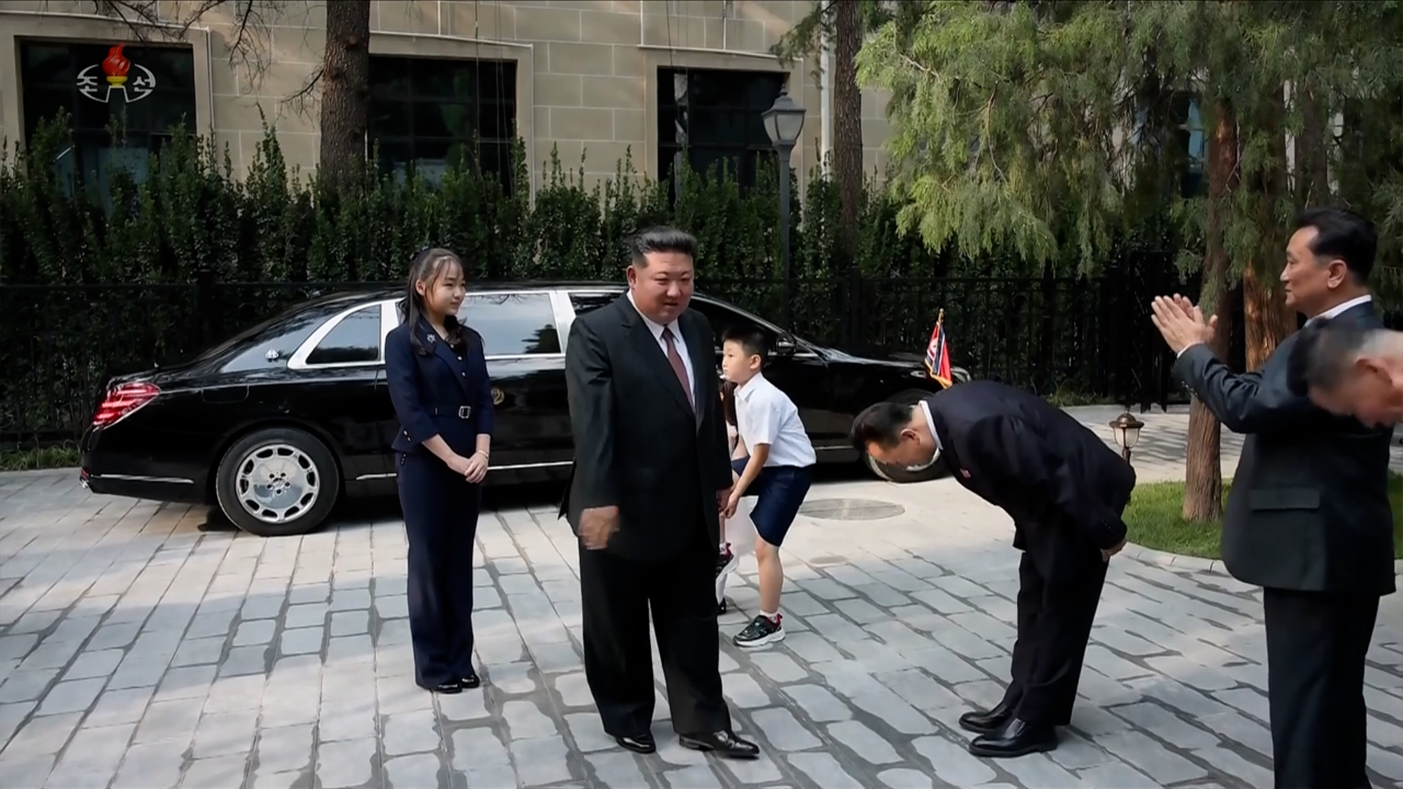 North Korean leader Kim Jong-un (second from left) visits the North Korean Embassy in China with his daughter Kim Ju-ae (left) during their recent trip to Beijing, in this image captured from a Korean Central Television broadcast that aired Sept. 6. (Yonhap)