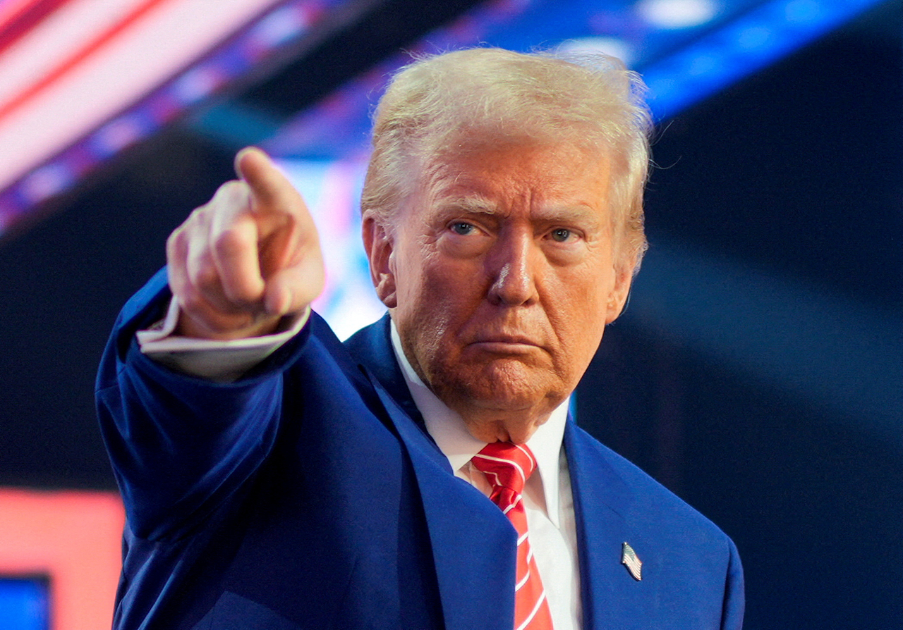 US President-elect Donald Trump gestures at Turning Point USA's AmericaFest in Phoenix, Arizona, Dec. 22.   Reuters-Yonhap