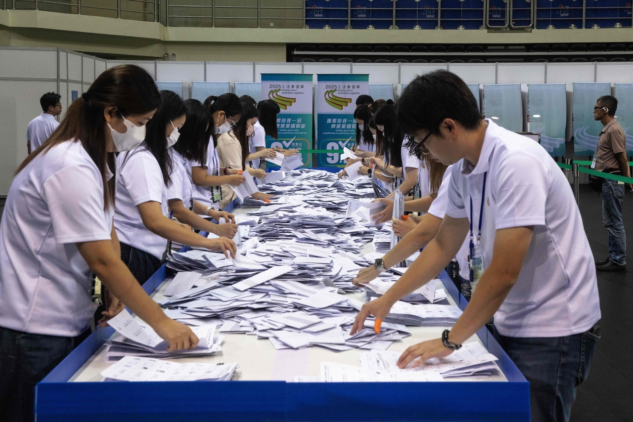 Members of the Electoral Affairs Commission of the Legislative Assembly count ballots after closing the polls for the Legislative Assembly election in Macau on Sunday. (AFP-Yonhap)