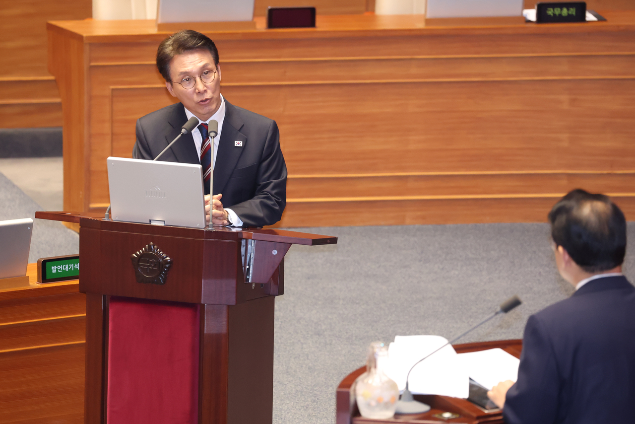 Prime Minister Kim Min-seok peaks during a plenary session of the National Assembly in Seoul on Tuesday to respond to questions relating to diplomacy, inter-Korean reunification and security by Rep. Bae June-young of the main opposition People Power Party. (Yonhap)