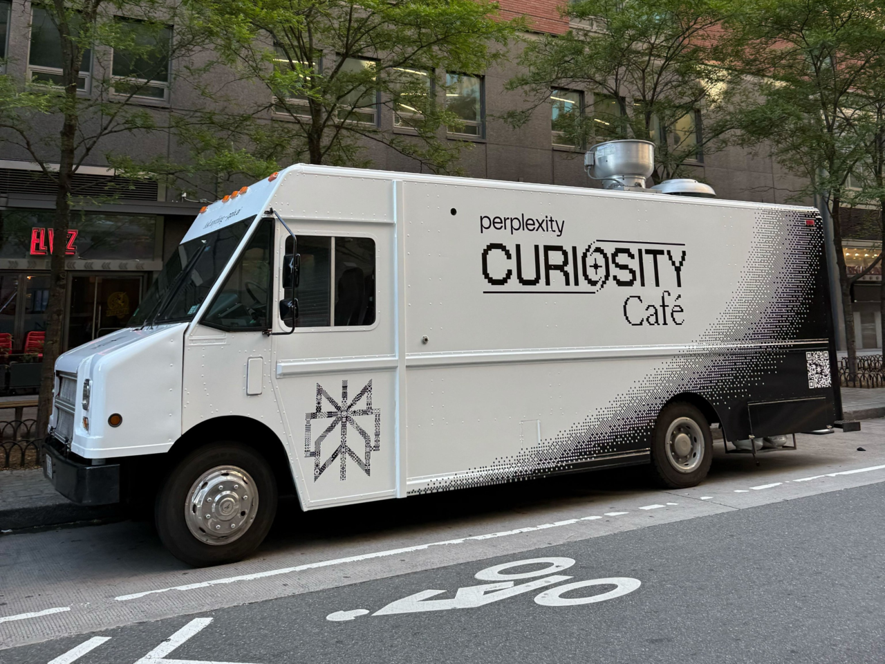Perplexity’s Curiosity Cafe truck toured New York City during Tech Week in June, offering free coffee to anyone who showed the app, with extras for Pro users. Like its Seoul cafe, the mobile pop-up was part of the company’s push to introduce AI through everyday, physical interactions. (Perplexity)