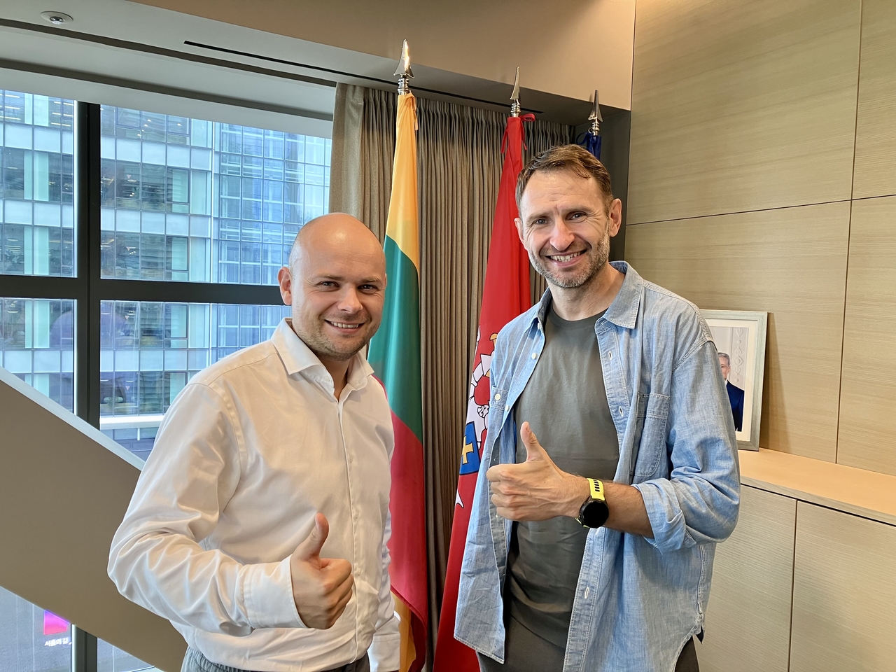 Lukas Jakubonis (left), chief business development officer at the Bank of Lithuania, and Elijus Civilis, general manager at Invest Lithuania, pose for photos after an interview with The Korea Herald at the  Embassy of Lithuania in South Korea at Gwanghwamun in central Seoul, Friday. (Im Eun-byel/The Korea Herald)