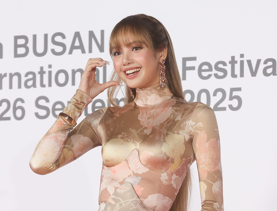 Blackpink's Lisa poses on the red carpet at the opening ceremony of the Busan International Film Festival at the Busan Cinema Center in Haeundae-gu, Busan, Wednesday. (Yonhap)