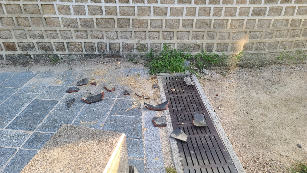 This photo distributed by the Korea Heritage Service shows the destroyed tiles from outer walls of Jongmyo Shrine in Jongno-gu, central Seoul, on Tuesday. (Korea Heritage Service via Yonhap)