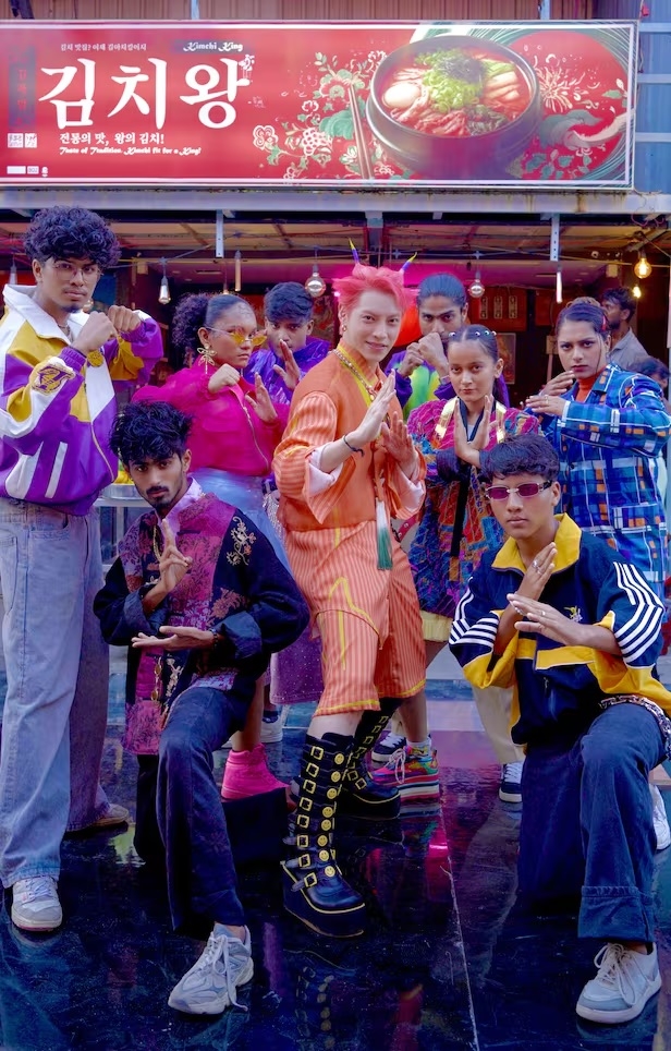 Korean singer Aoora (center) poses with Indian dancers while filming the "Kimchi Dosa" music video. (Cheers Music, VectorMob , HBC HOUSE)