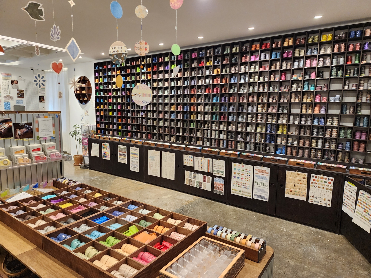 Numerous rolls of masking tape are displayed on shelves at Rolledpaint. (Hwang Dong-hee/The Korea Herald)