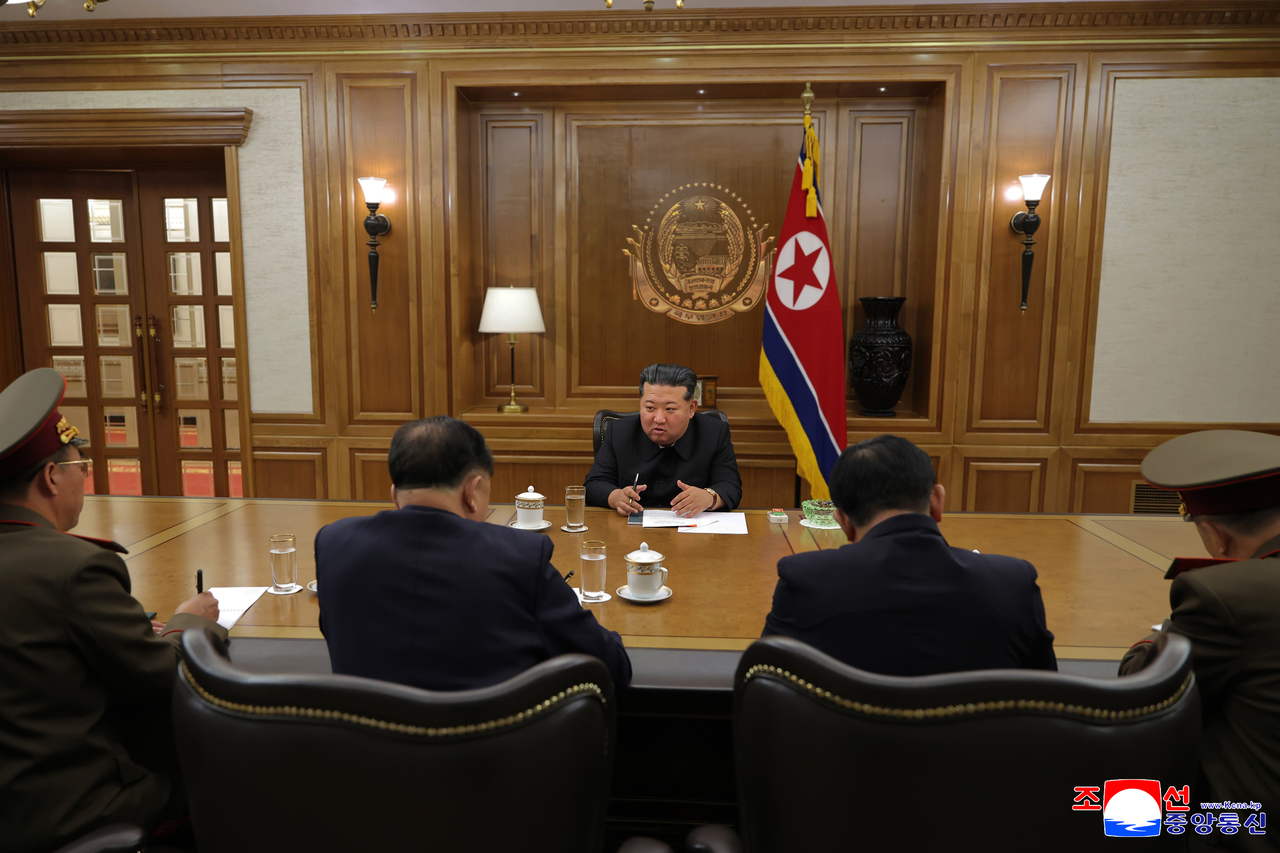 North Korean leader Kim Jong-un (C) presides over a key consultative meeting on the production of nuclear materials and weapons on Friday, in this photo carried by the North's official Korean Central News Agency the following day. (For Use Only in the Republic of Korea. No Redistribution) (Yonhap)