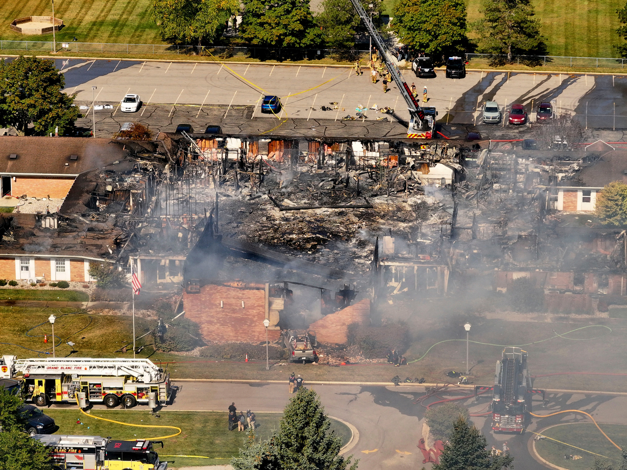 Emergency crews respond to a shooting and fire at The Church of Jesus Christ of Latter-day Saints, in Grand Blanc, Mich., Sunday. (AP-Yonhap)