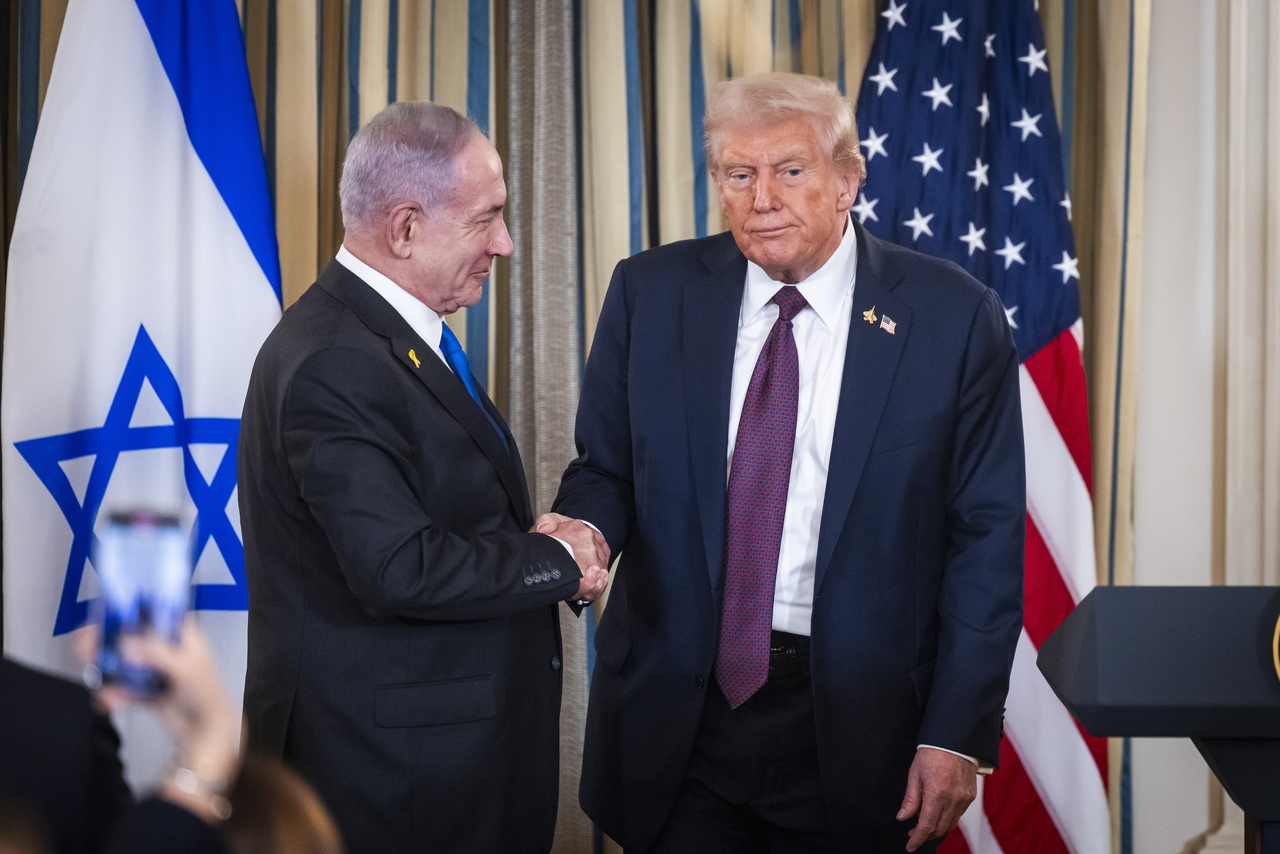 US President Donald Trump (right) shakes hands with Israeli Prime Minister Benjamin Netanyahu after they spoke at a press conference in the State Dining Room of the White House in Washington on Wednesday.   EPA-Yonhap