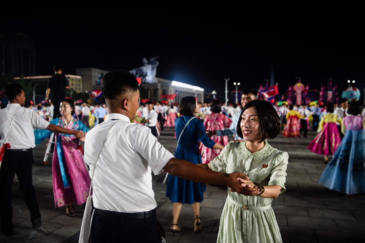 Participants dance during an evening gala held as part of celebrations on the occasion of the 77th founding anniversary of North Korea at Kim Il Sung Square in Pyongyang on Sept. 8, 2025. (Kim Won Jin/AFP)