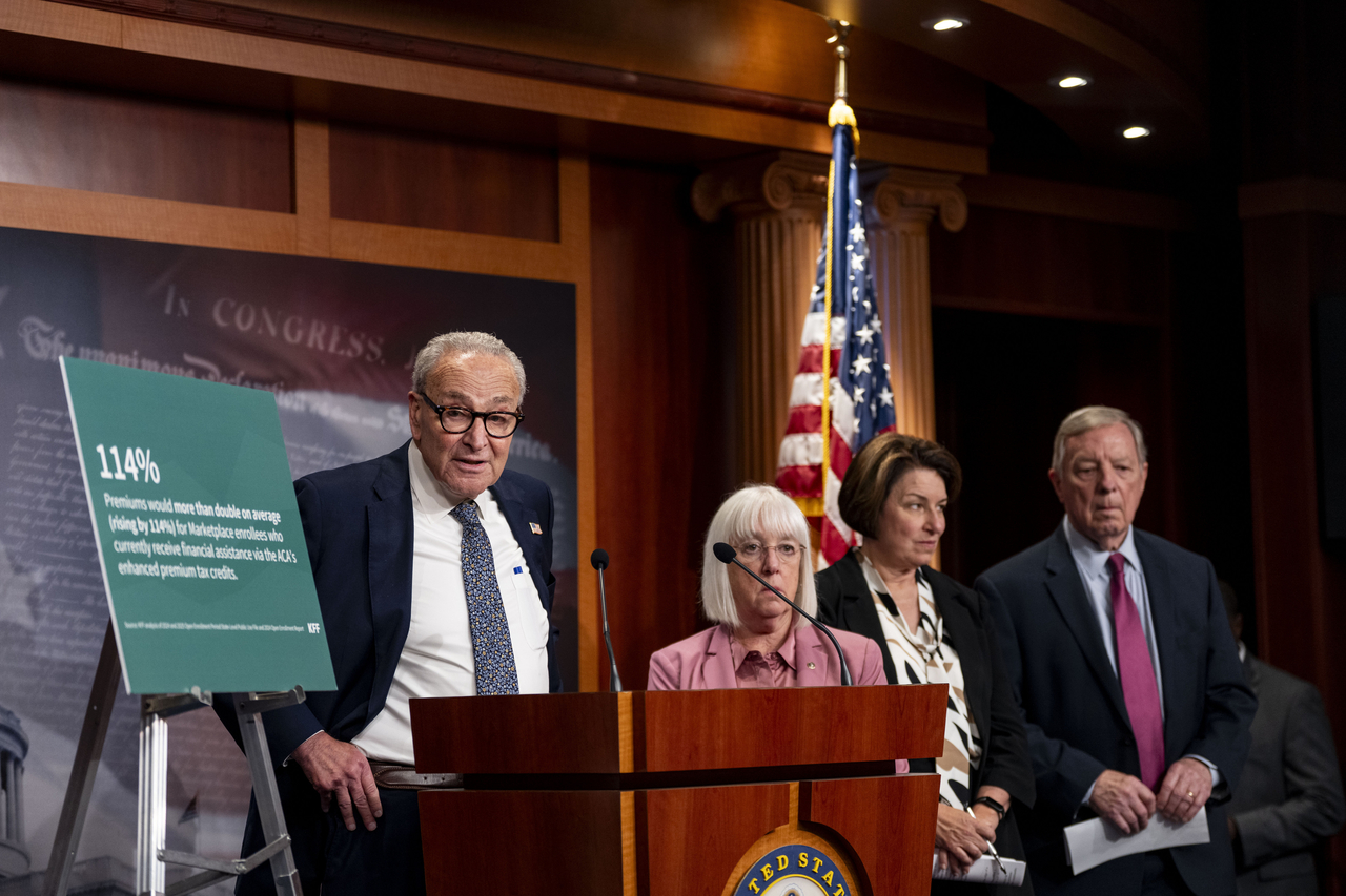 Senate Minority Leader Chuck Schumer (left) speaks to the press after the Senate failed to pass both the Democrat's proposed continuing resolution and the House-passed government funding bill at the US Capitol in Washington on Tuesday.   UPI-Yonhap